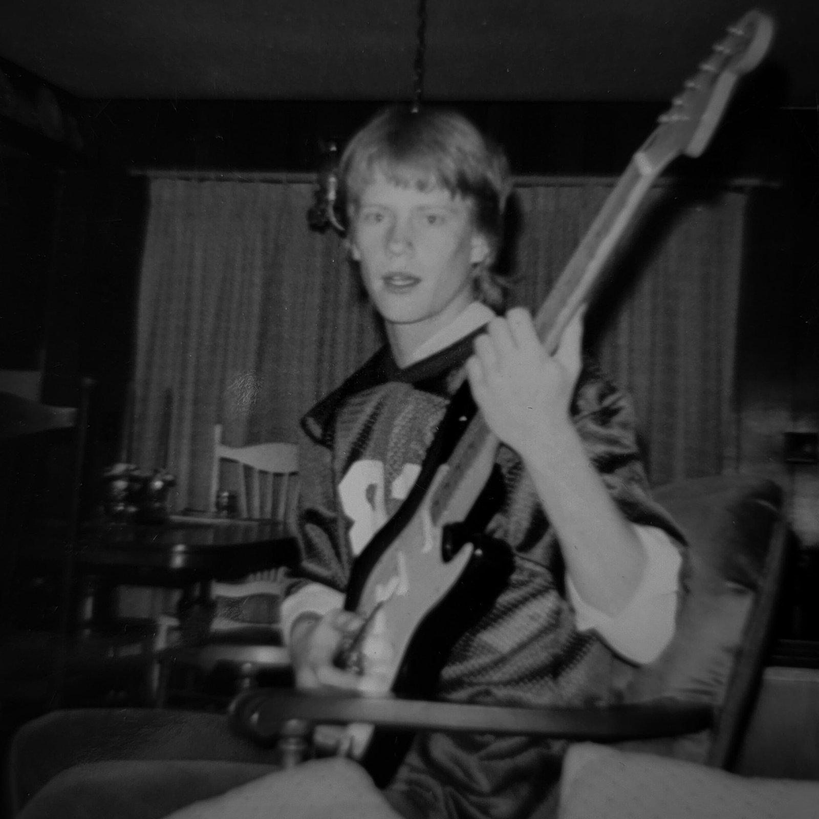 Darrick with his first guitar - the moment where a lifelong love of music and guitars. What started here would become a passion that runs deep to this day.