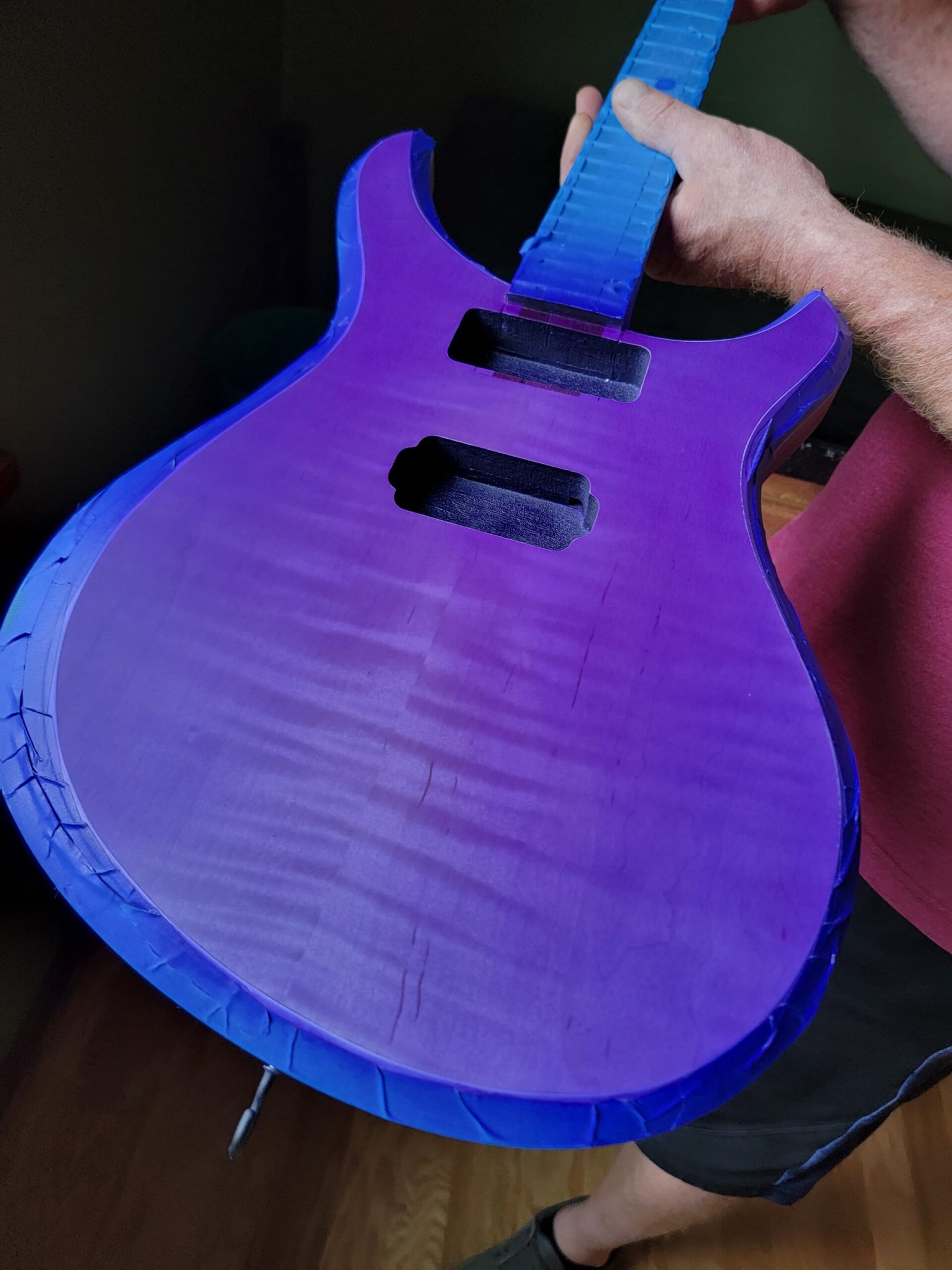 Initial color application on our Ichor guitar, featuring a unique color that shifts with the light - one of the coolest colors offered by Ellehsem Guitars.